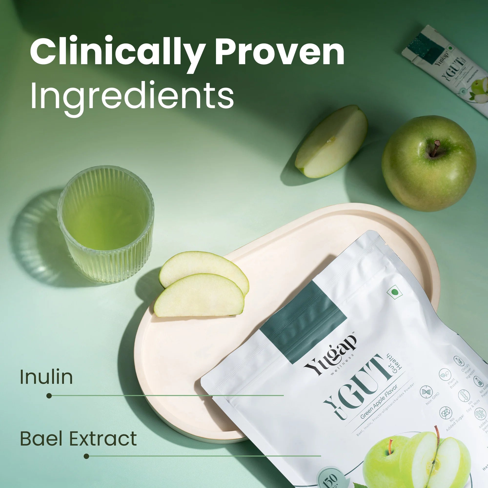 Yugap YuGut sachet featuring gut-friendly ingredients inulin and bael extract with green apple slices and herbal drink on a green-toned background.