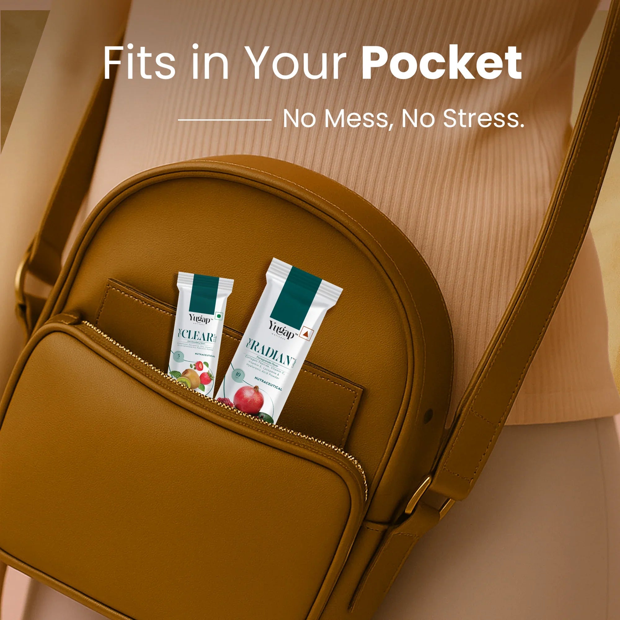 Two Yugap wellness portable sachets—Yugut apple and Yuradian pomegranate—in a compact brown purse pocket, ideal for on-the-go gut and skin health support with no mess and no stress