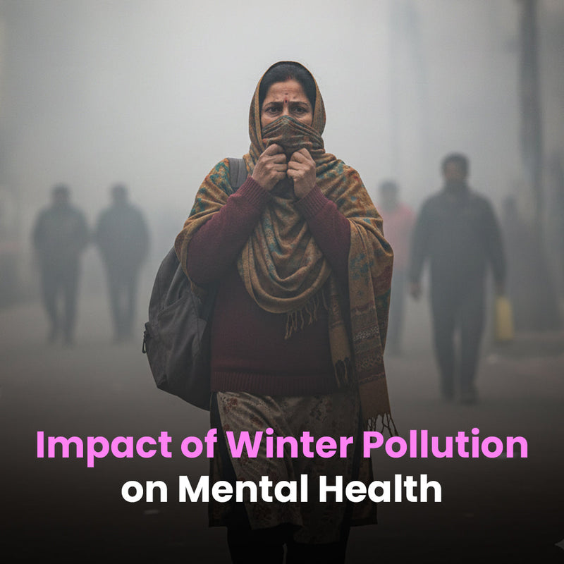 Woman in winter clothing covering face walking through heavy smog and air pollution on city street with text 'Impact of Winter Pollution on Mental Health