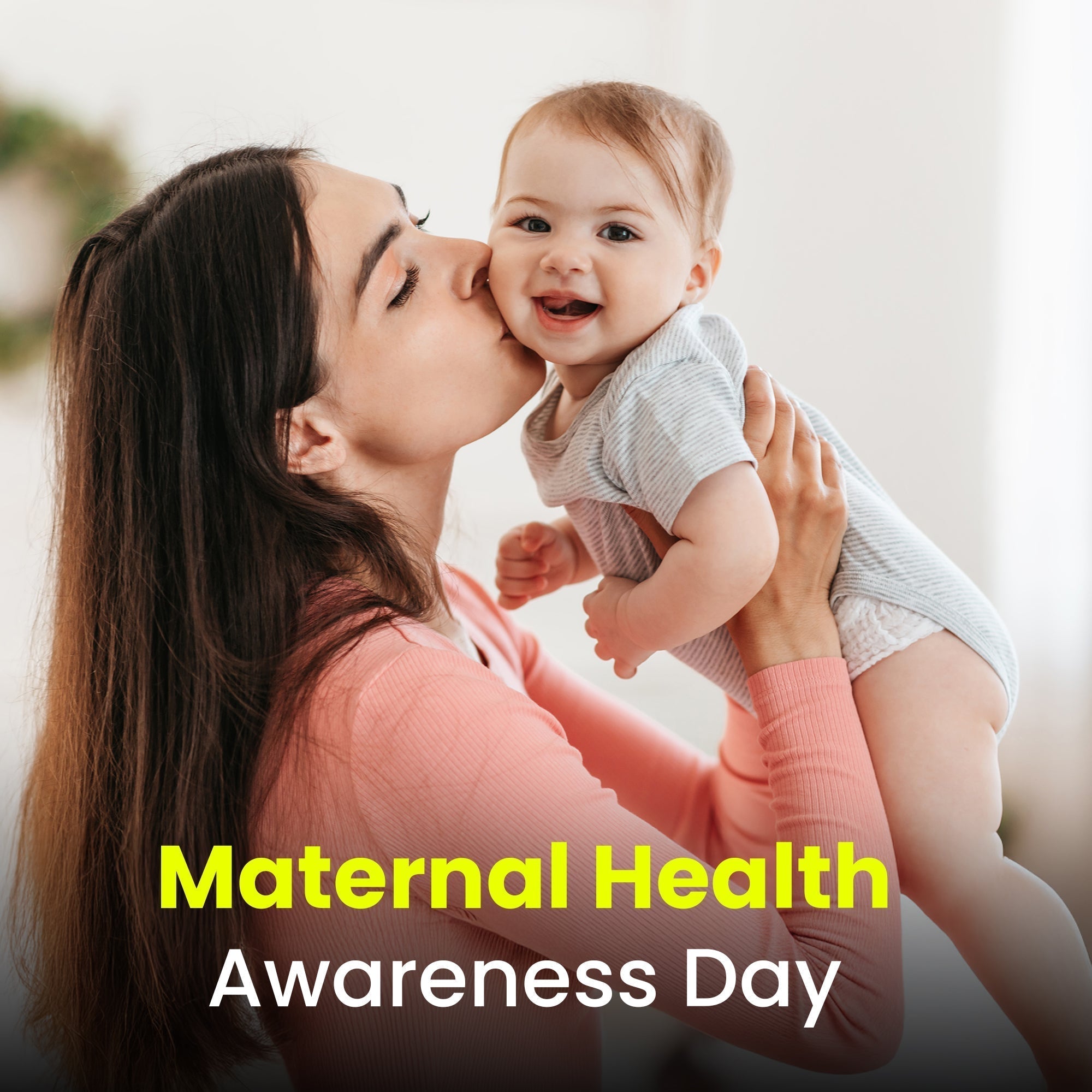 Maternal Health Awareness Day graphic featuring a mother in a pink top kissing her smiling baby’s cheek.