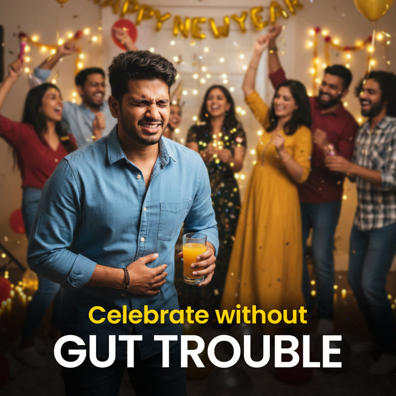 Man holding a drink at a festive New Year party, looking uncomfortable with stomach pain while friends celebrate in the background, highlighting gut discomfort during celebrations.
