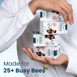 Two hands stacking four Yugap supplement boxes, highlighting “Made for 25+ busy bees” message, showcasing convenient daily wellness packaging on light background