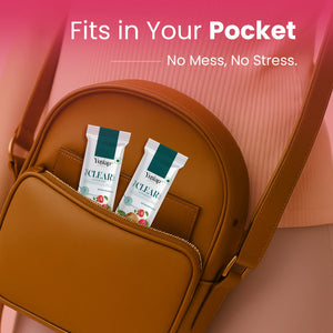 Two Yugap Yuclear acne care sachets in a compact brown sling bag with text ‘Fits in Your Pocket, No Mess, No Stress’ on a pink background, highlighting travel-friendly skin supplement packaging.