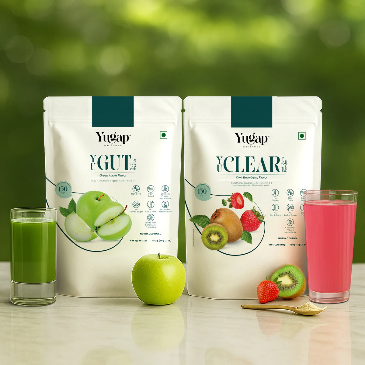 Yugap Yugut apple probiotic pouch and Yuclear kiwi strawberry pouch displayed with fresh green apple, kiwi, strawberry, green juice, and pink drink on natural background, highlighting a combo for gut health and skin wellness