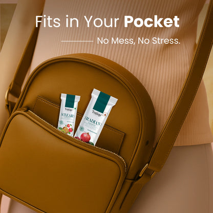 Two Yugap wellness portable sachets—Yugut apple and Yuradian pomegranate—in a compact brown purse pocket, ideal for on-the-go gut and skin health support with no mess and no stress