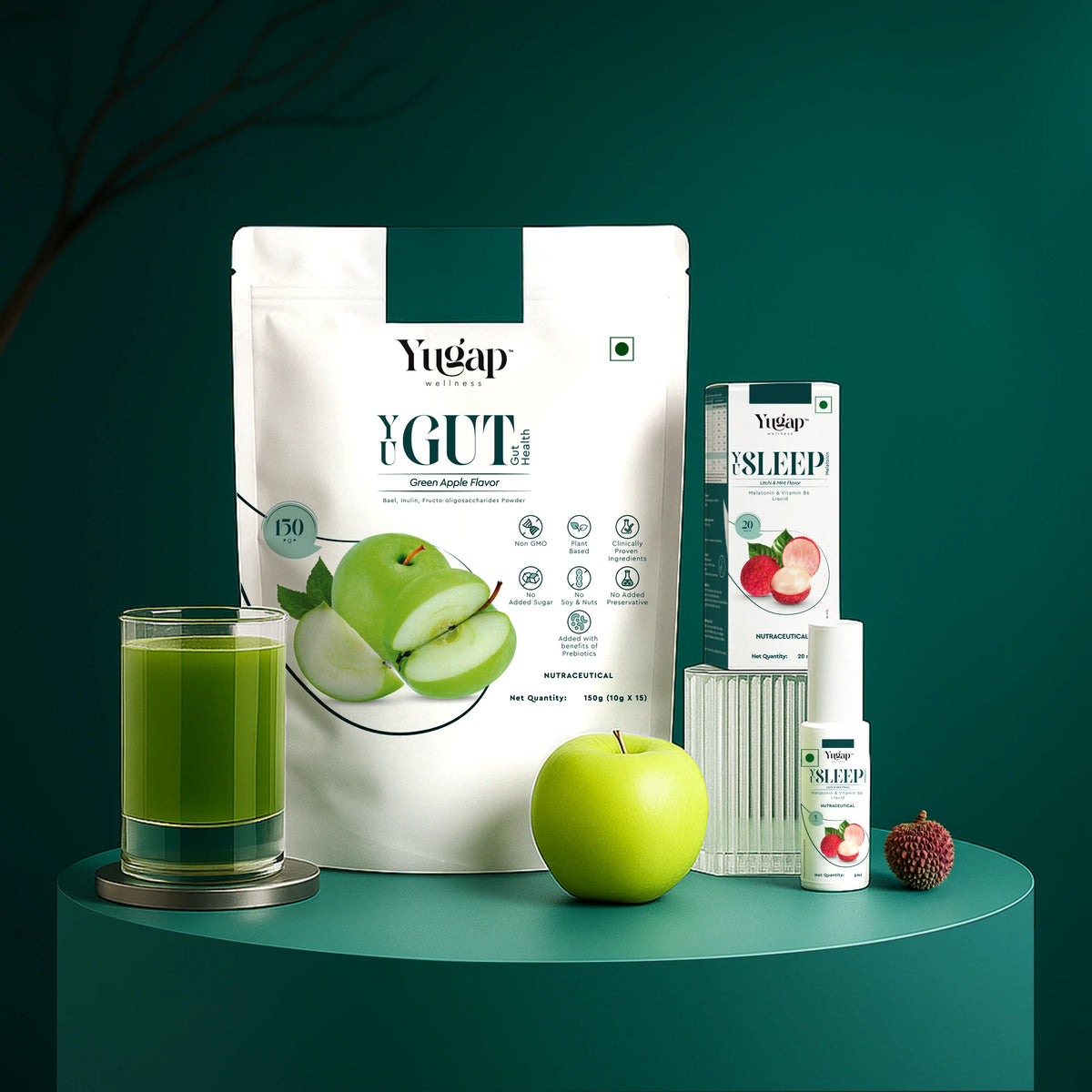 Yugap YGute apple probiotic pouch, Yugap Sleep spray box and bottle, fresh green apple, and green juice displayed on dark green pedestal, highlighting digestive wellness and restful sleep combo